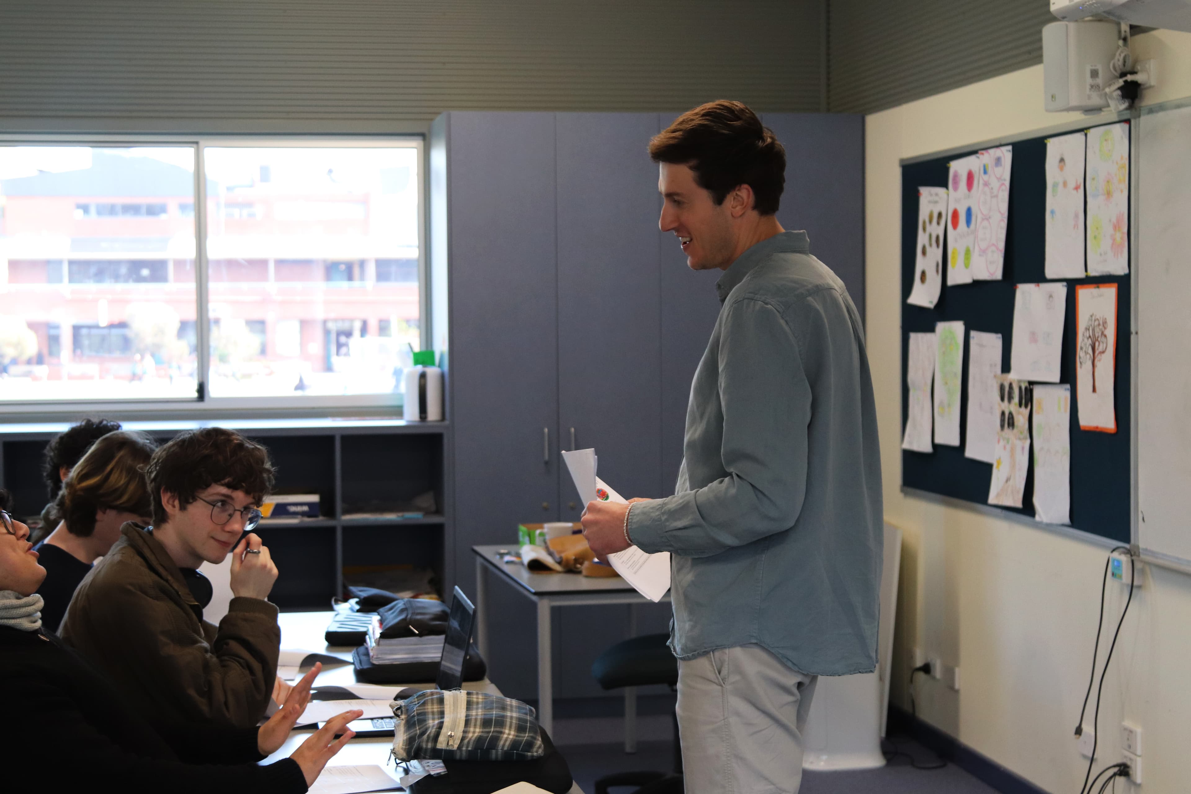 Chris Bush engaging with students in the classroom